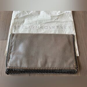 Stella McCartney Falabella Shaggy Deer fold-over clutch, shimmering beige tone.